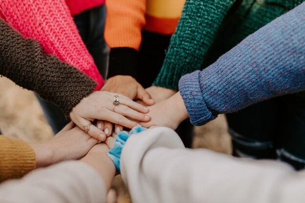 group with hands in middle